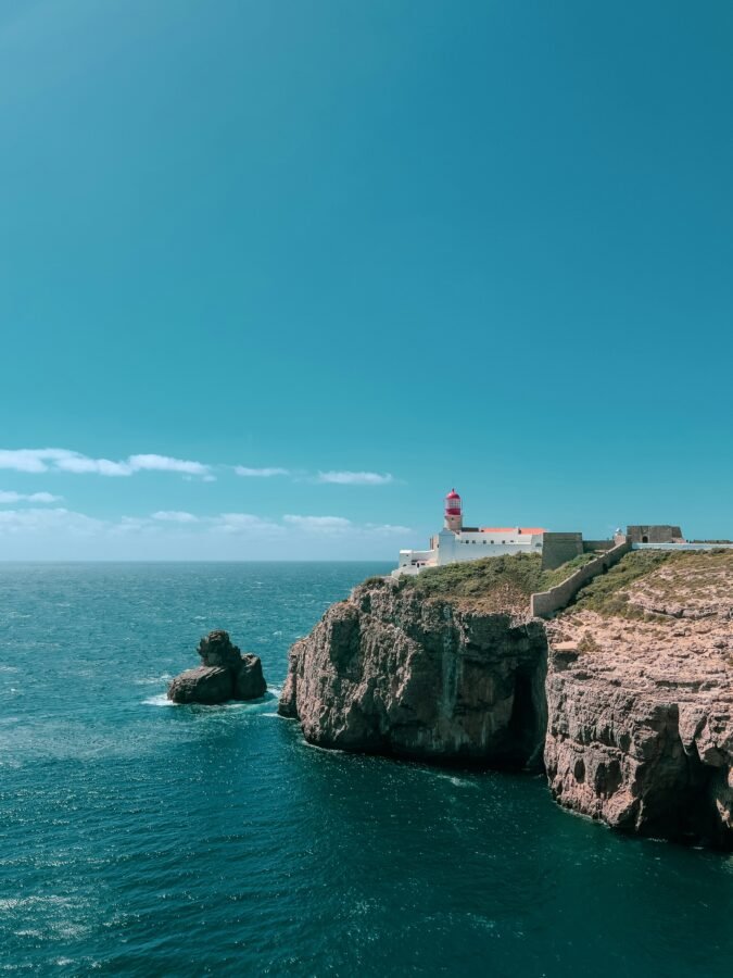 Cabo da Roca Lighthouse on a rocky headland above the Atlantic.