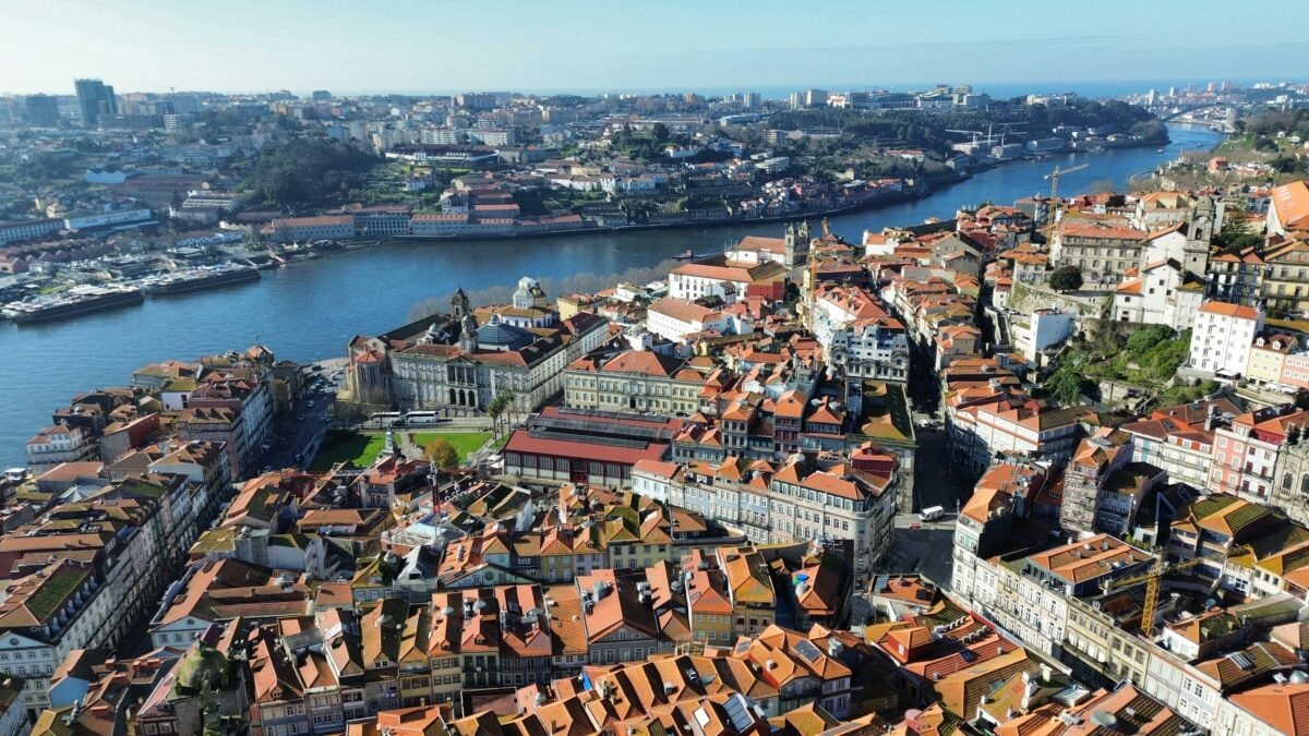 Terracotta rooftops of Porto beside the Douro, with Vila Nova de Gaia on the opposite bank