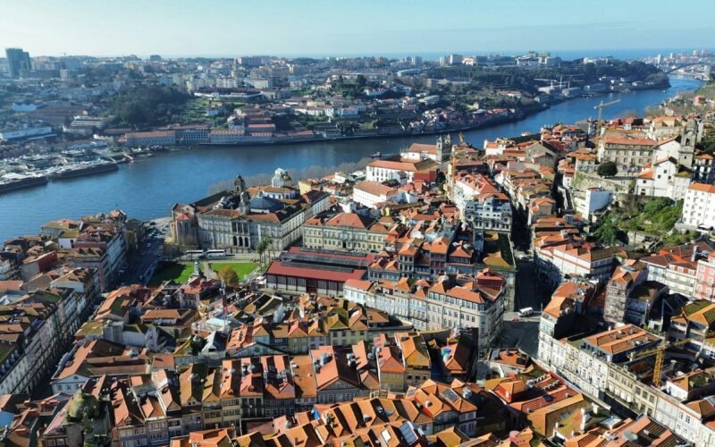 Terracotta rooftops of Porto beside the Douro, with Vila Nova de Gaia on the opposite bank