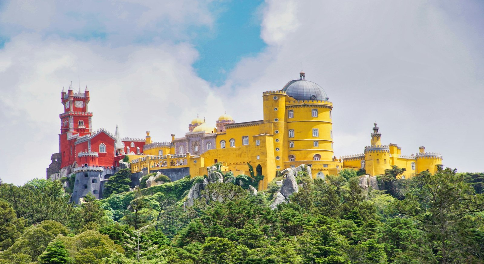 Colourful Pena Palace rising above the green Sintra hills