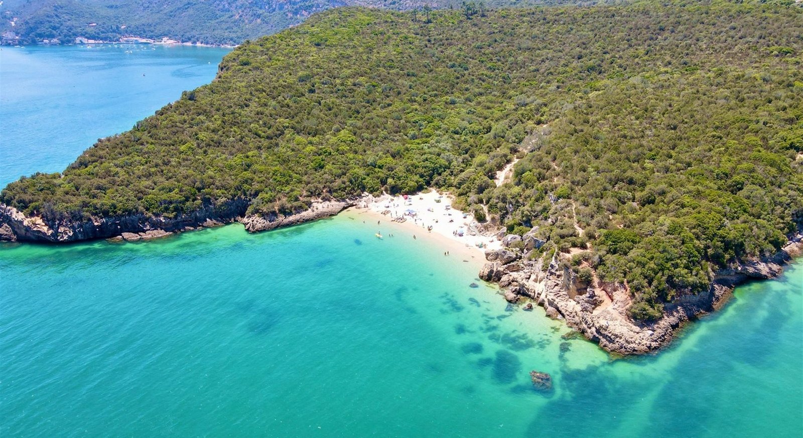 Wooded Arrábida coastline and turquoise sea near Setubal
