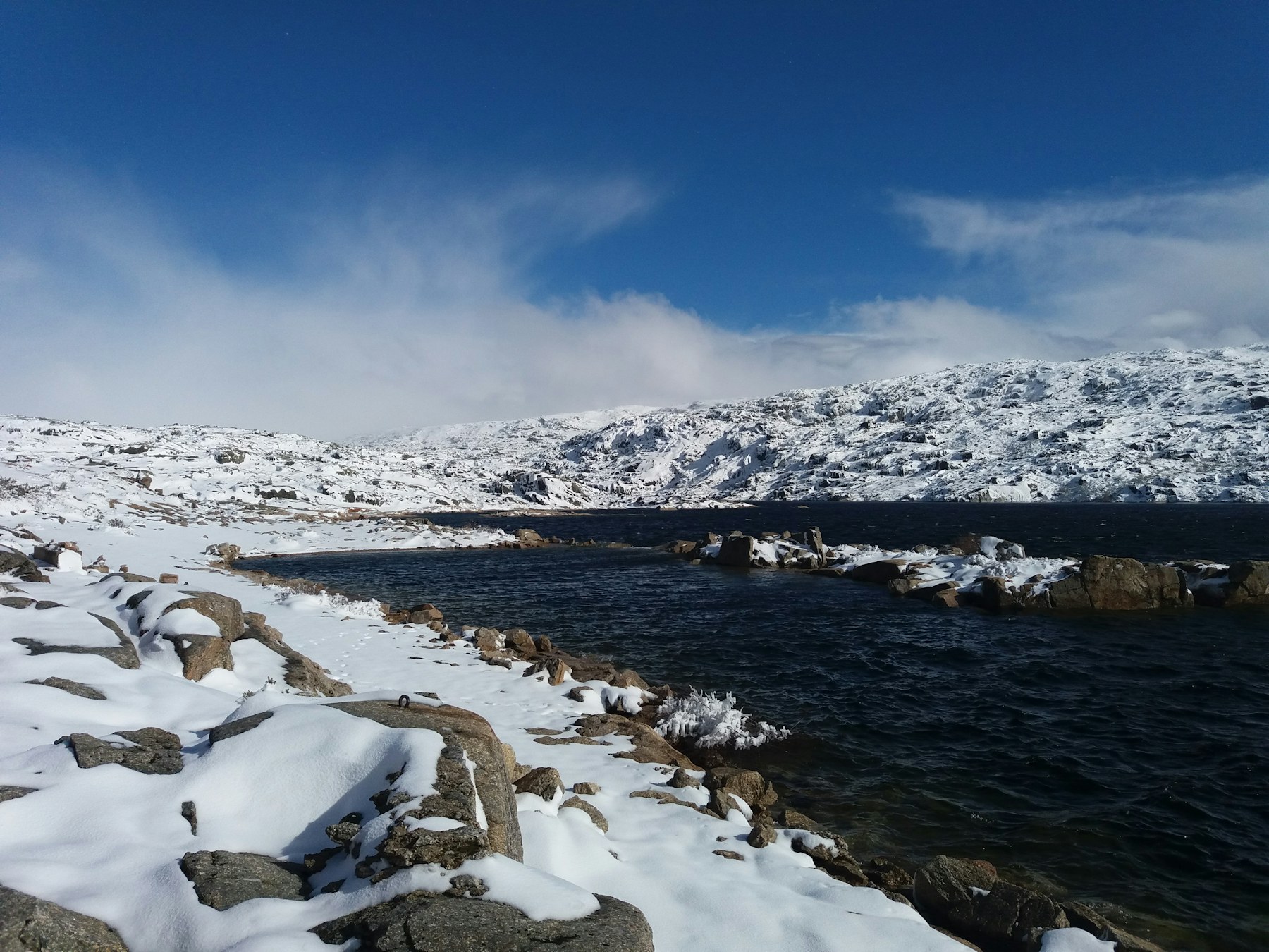 Snowy mountain lake in Serra da Estrela