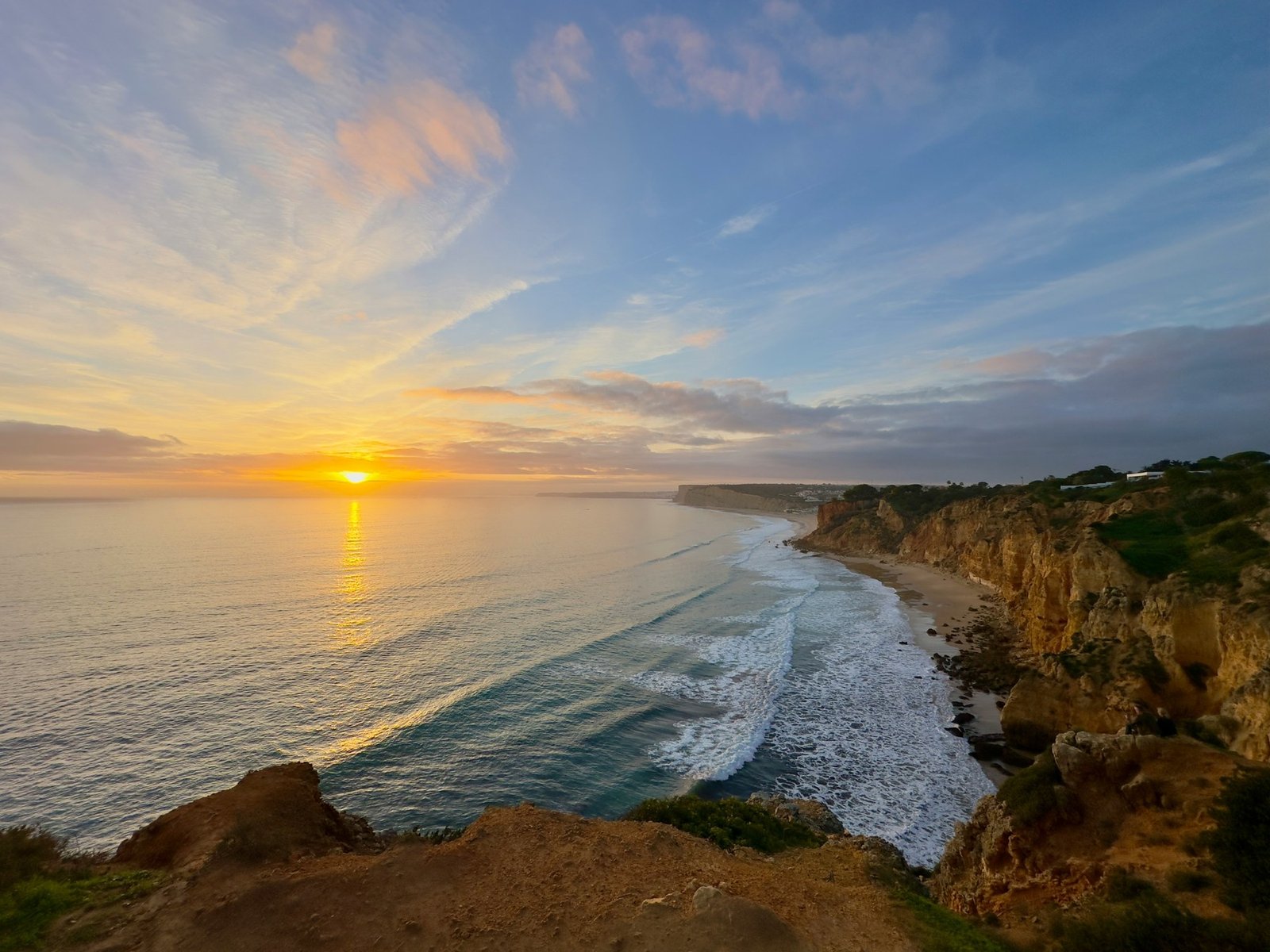 Sunset over the Atlantic and the cliff-lined coast at Ponta da Piedade, Lagos