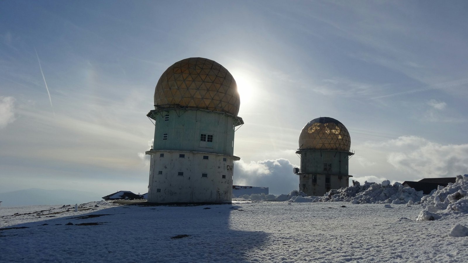 Two domed towers surrounded by snow in Serra da Estrela