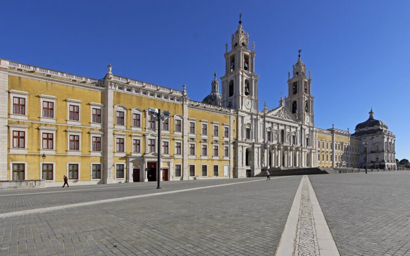 Mafra National Palace façade and basilica under a clear sky