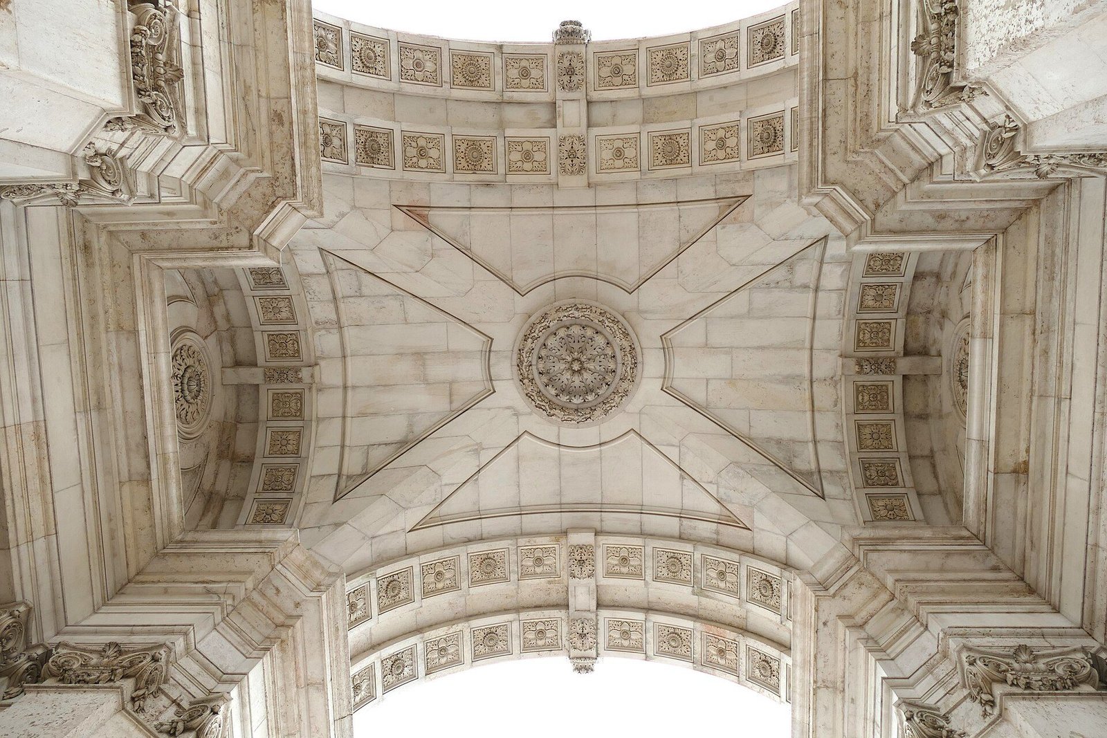 Sculpted stone ceiling beneath Rua Augusta Arch in Lisbon