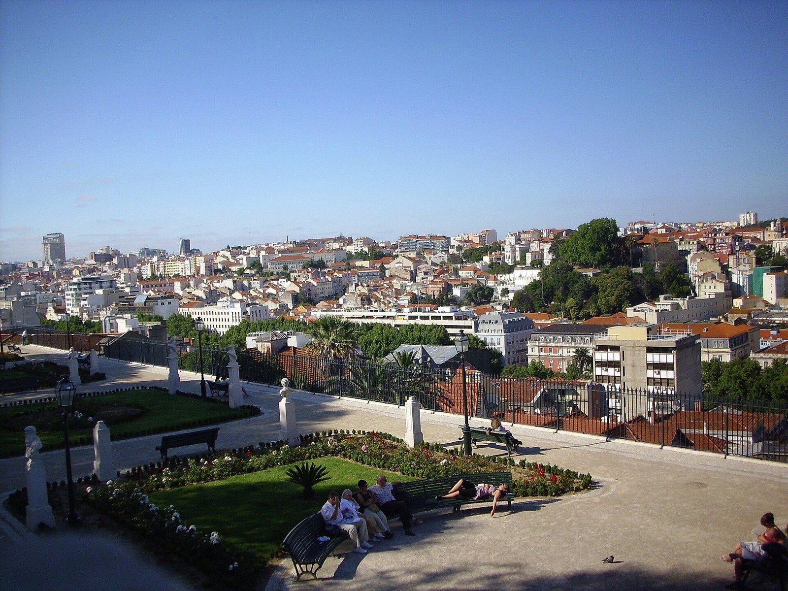 Garden paths and clipped planting at São Pedro de Alcântara with Lisbon beyond