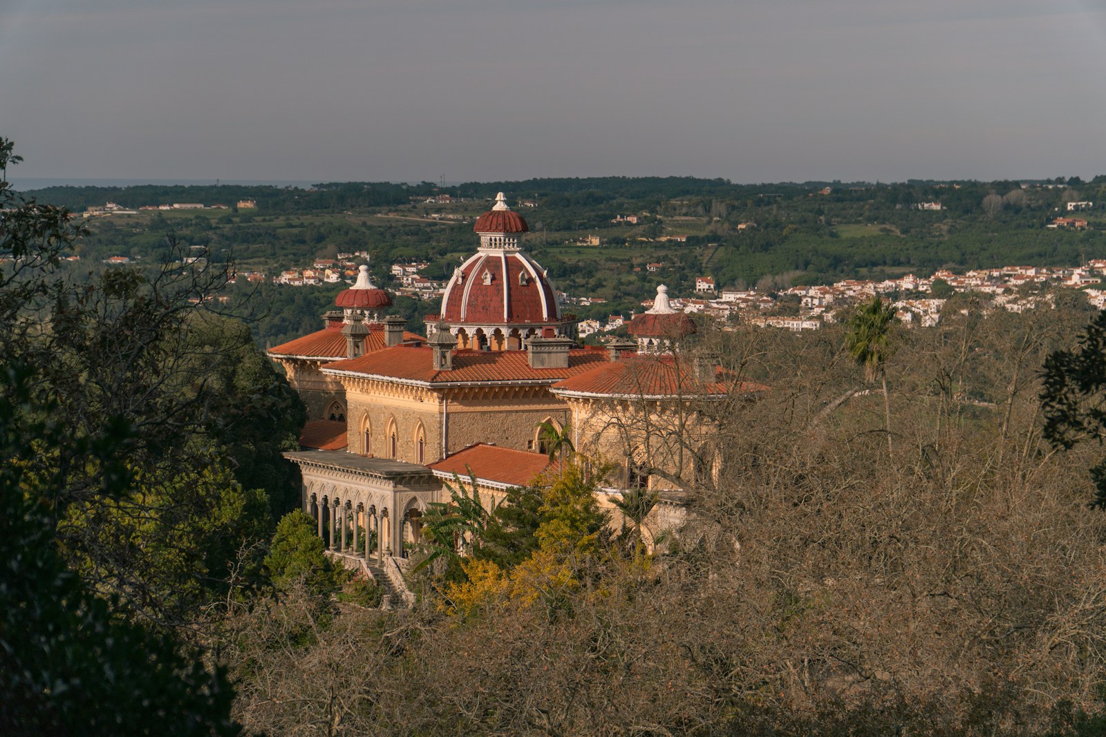 Monserrate Palace and its red domes among trees in Sintra, photographed before the roof works