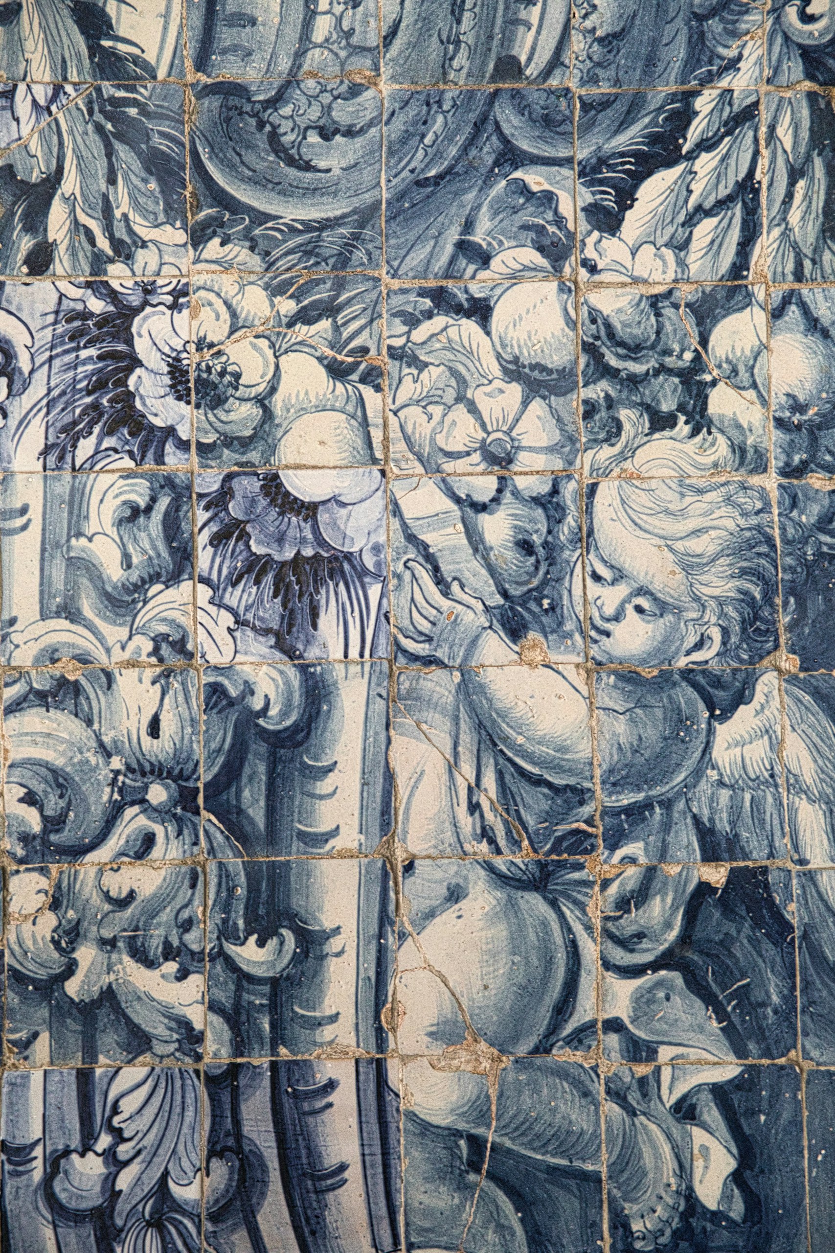 Blue-and-white azulejos form a floral mural inside Porto Cathedral.