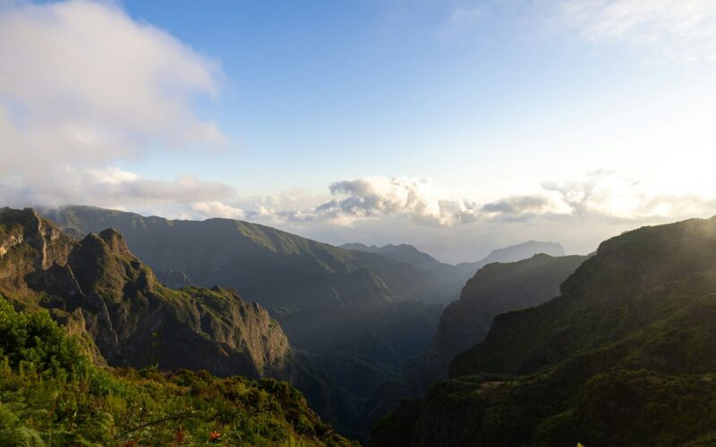 Mountain ridges and valleys near Pico do Areeiro beneath clouds and morning light