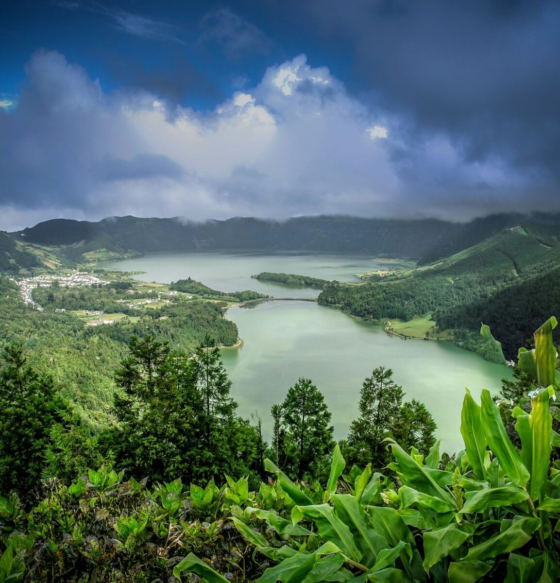 The lakes and village of Sete Cidades within green slopes beneath low cloud