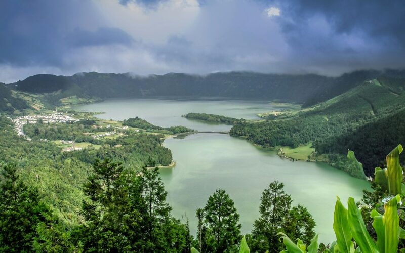 The lakes and village of Sete Cidades within green slopes beneath low cloud