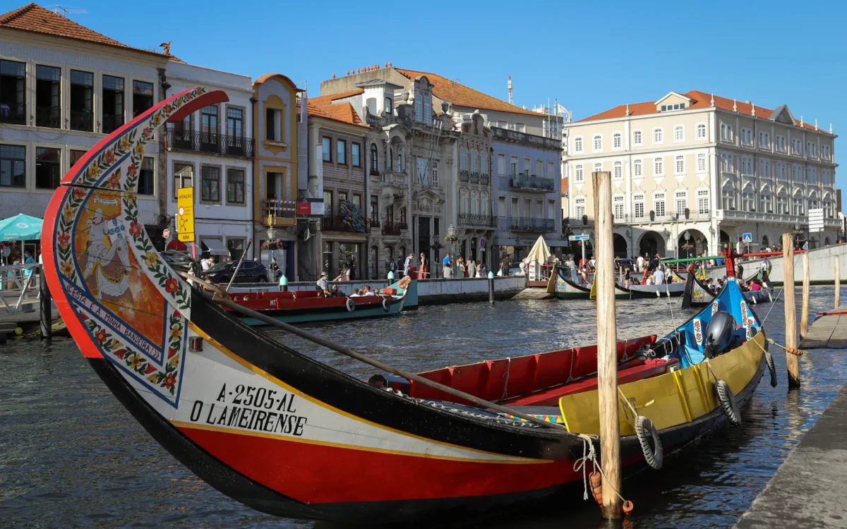 Colourful moliceiro boats on a canal in Aveiro, Portugal
