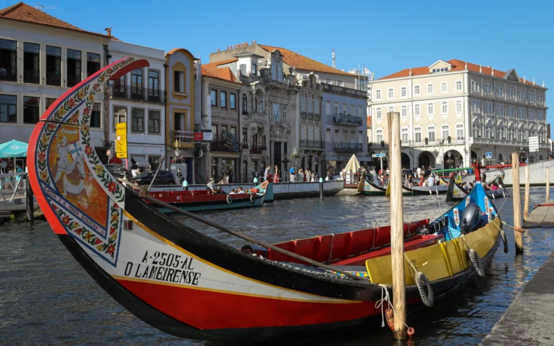 Colourful moliceiro boats on a canal in Aveiro, Portugal