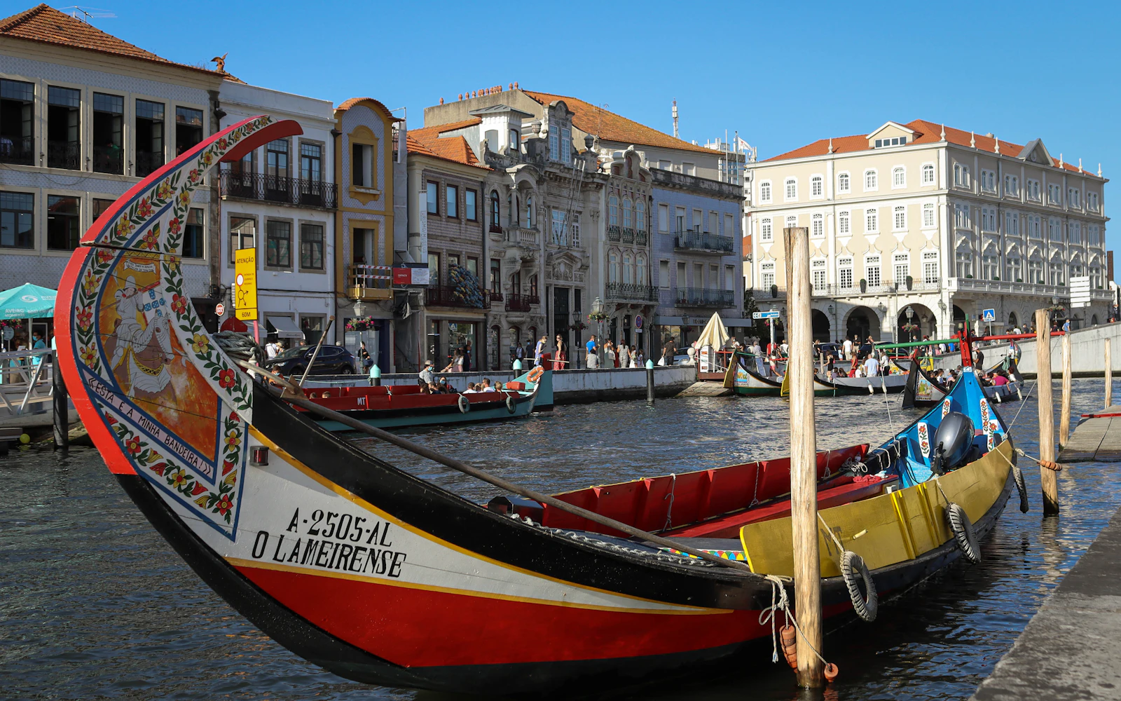 Colourful moliceiro boats on a canal in Aveiro, Portugal