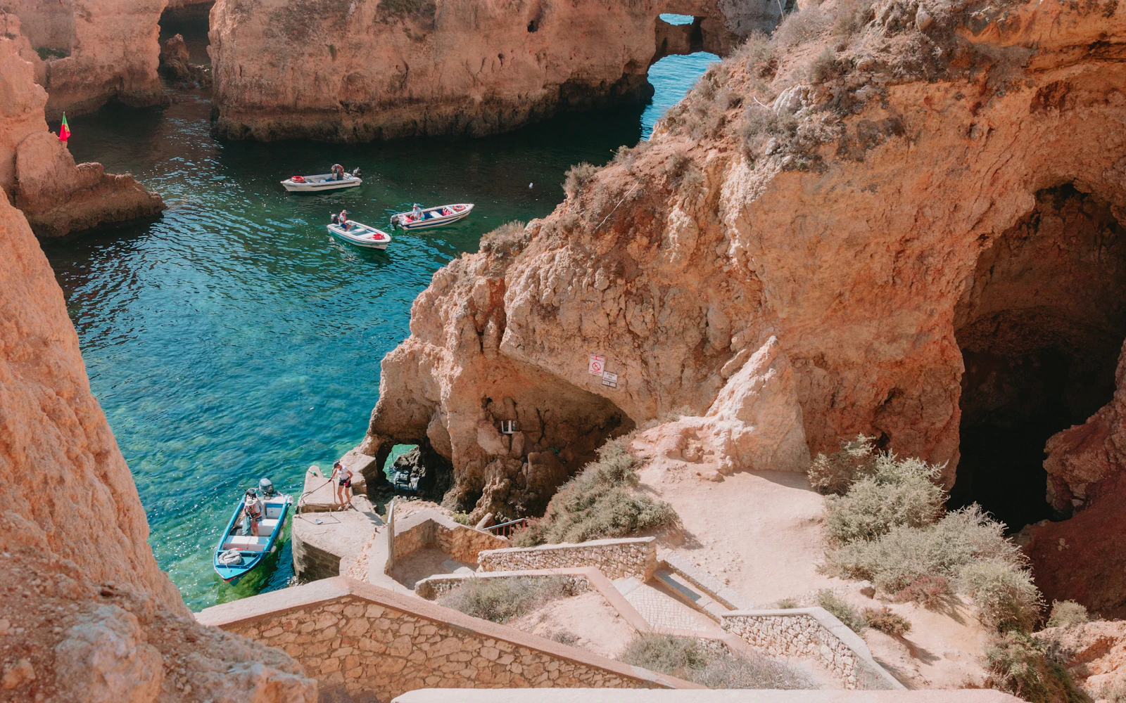 Dramatic golden sea cliffs and azure waters of the Algarve